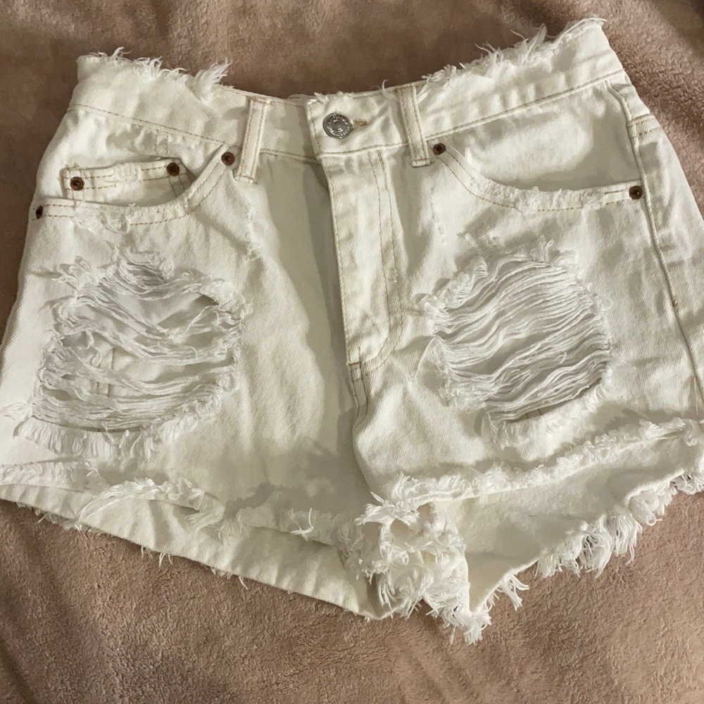 Ripped white shorts